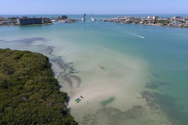 A family enjoying one of the exposed sandbars at John's Pass Islands!